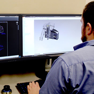 Fluid Air Engineer employee reviewing CAD model