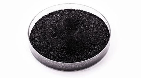 graphite powder in clear dish