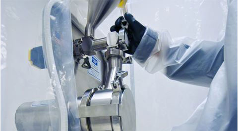 gloved hand of technician using granumill equipment with a Fluid Air logo